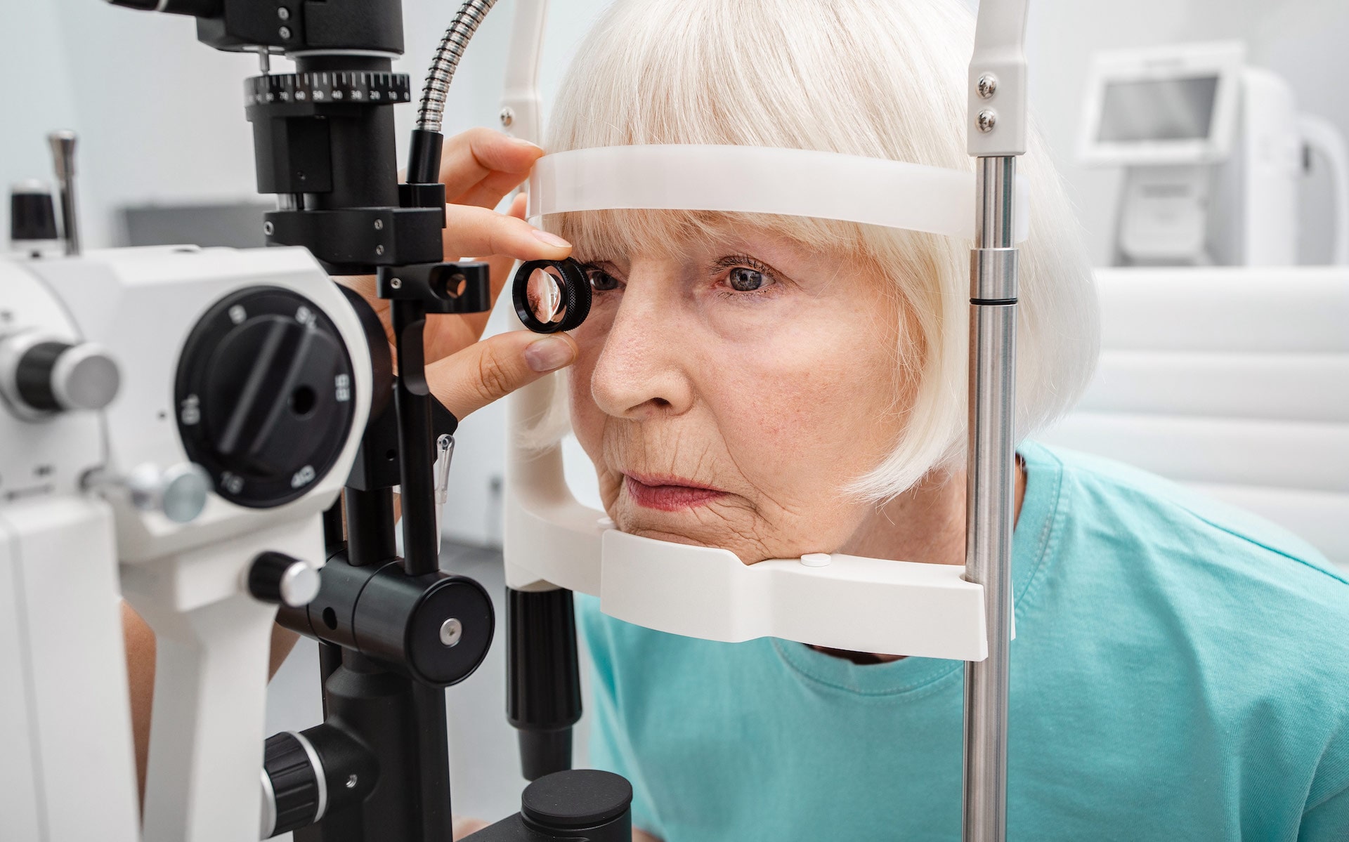 elderly patient receiving an eye exam